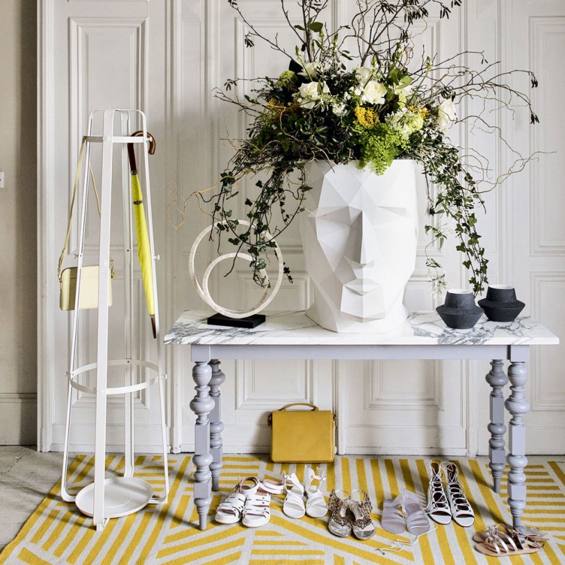 White-modern-hallway-with-console-and-yellow-rug